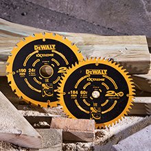 Two saw blades leaned against wooden bars